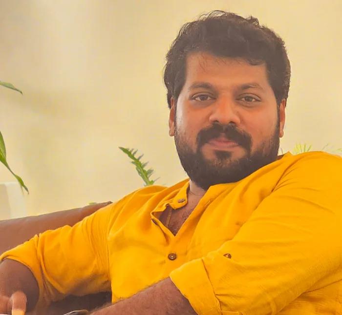 Rahul in a yellow shirt