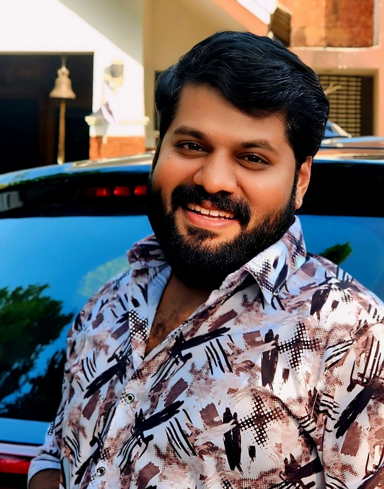 Rahul smiling outdoors