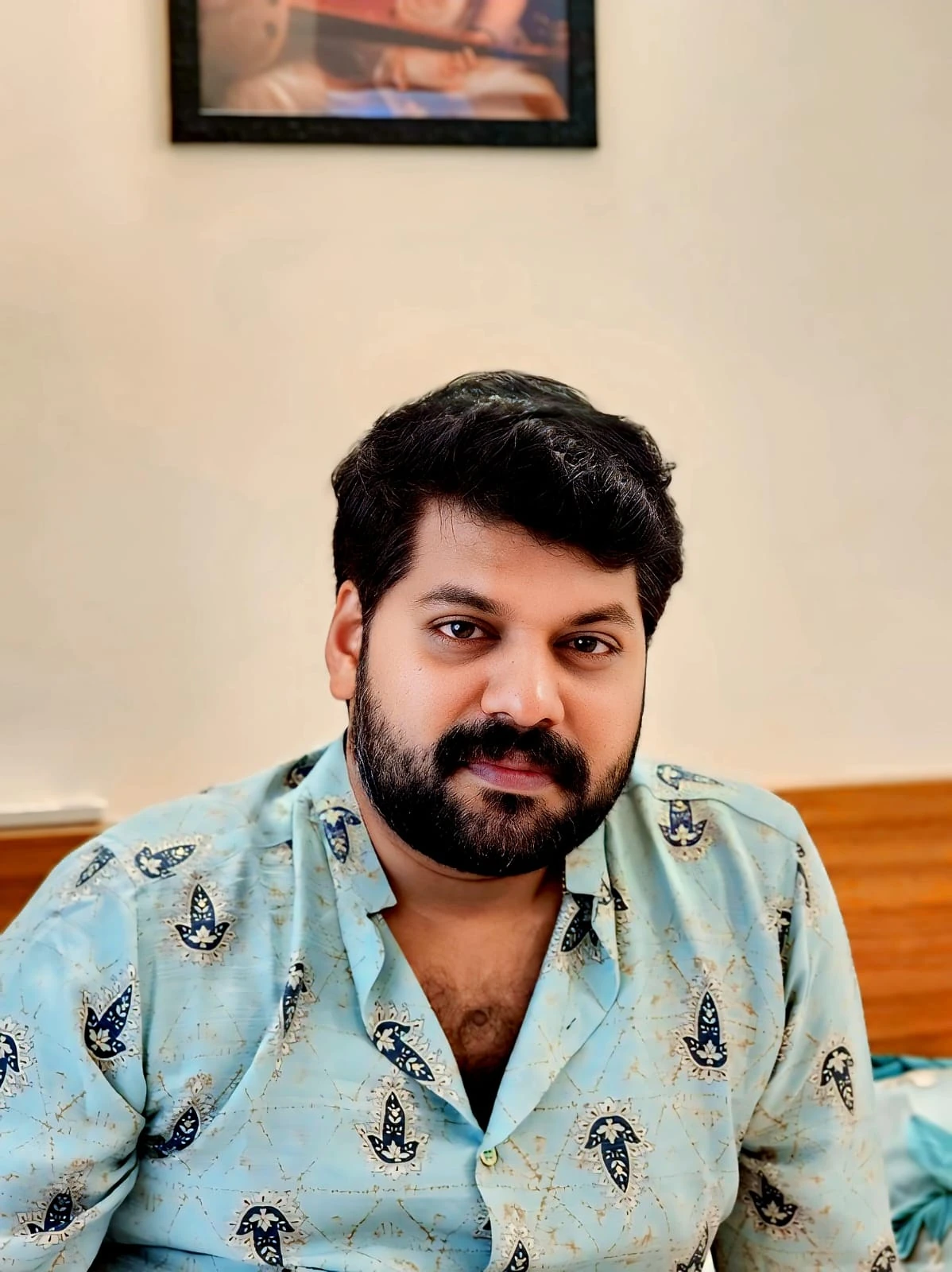 V. Rahul Venugopal wearing a pale blue patterned shirt